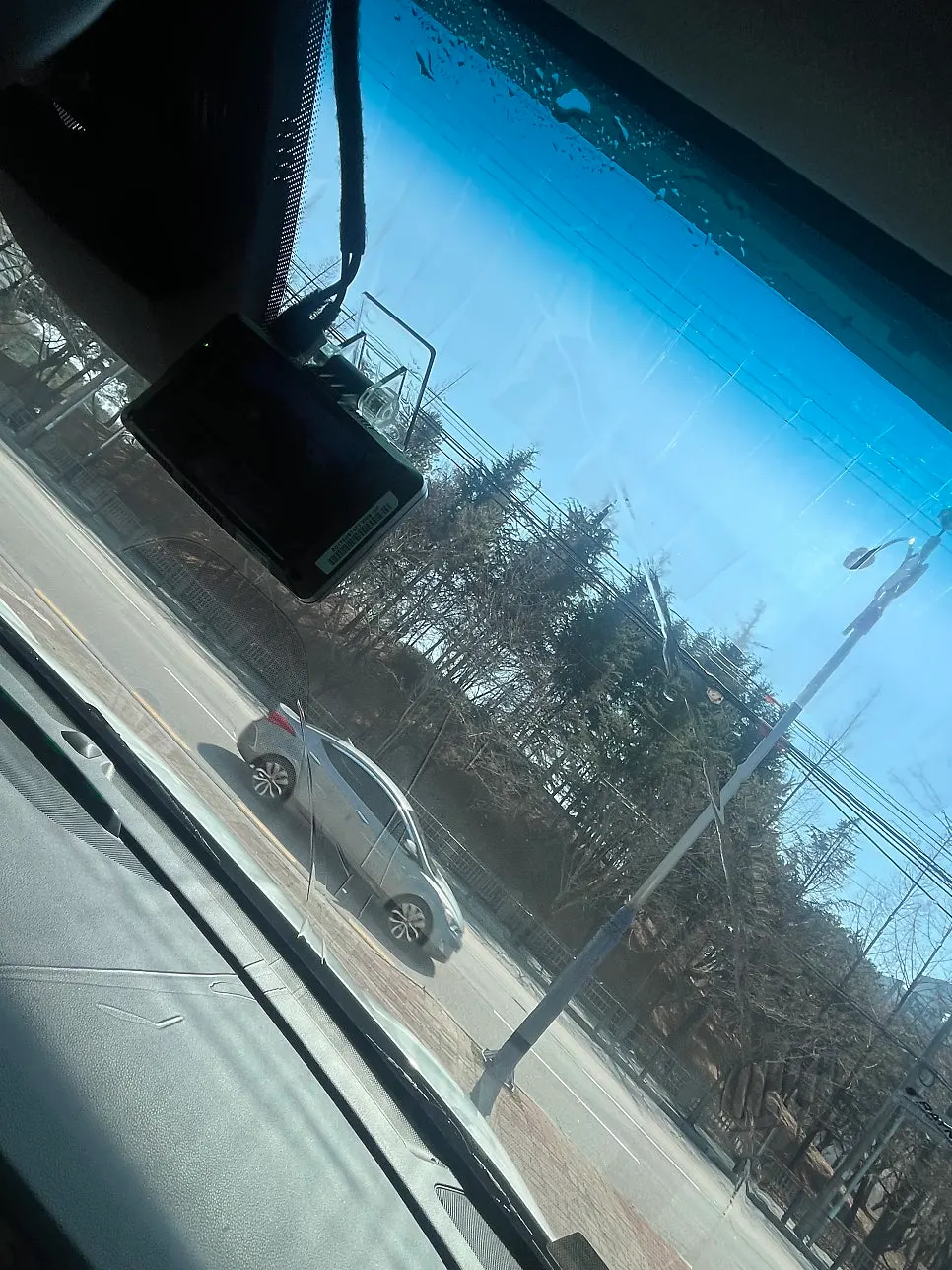 Windshield viewed from inside the car after oil film removal