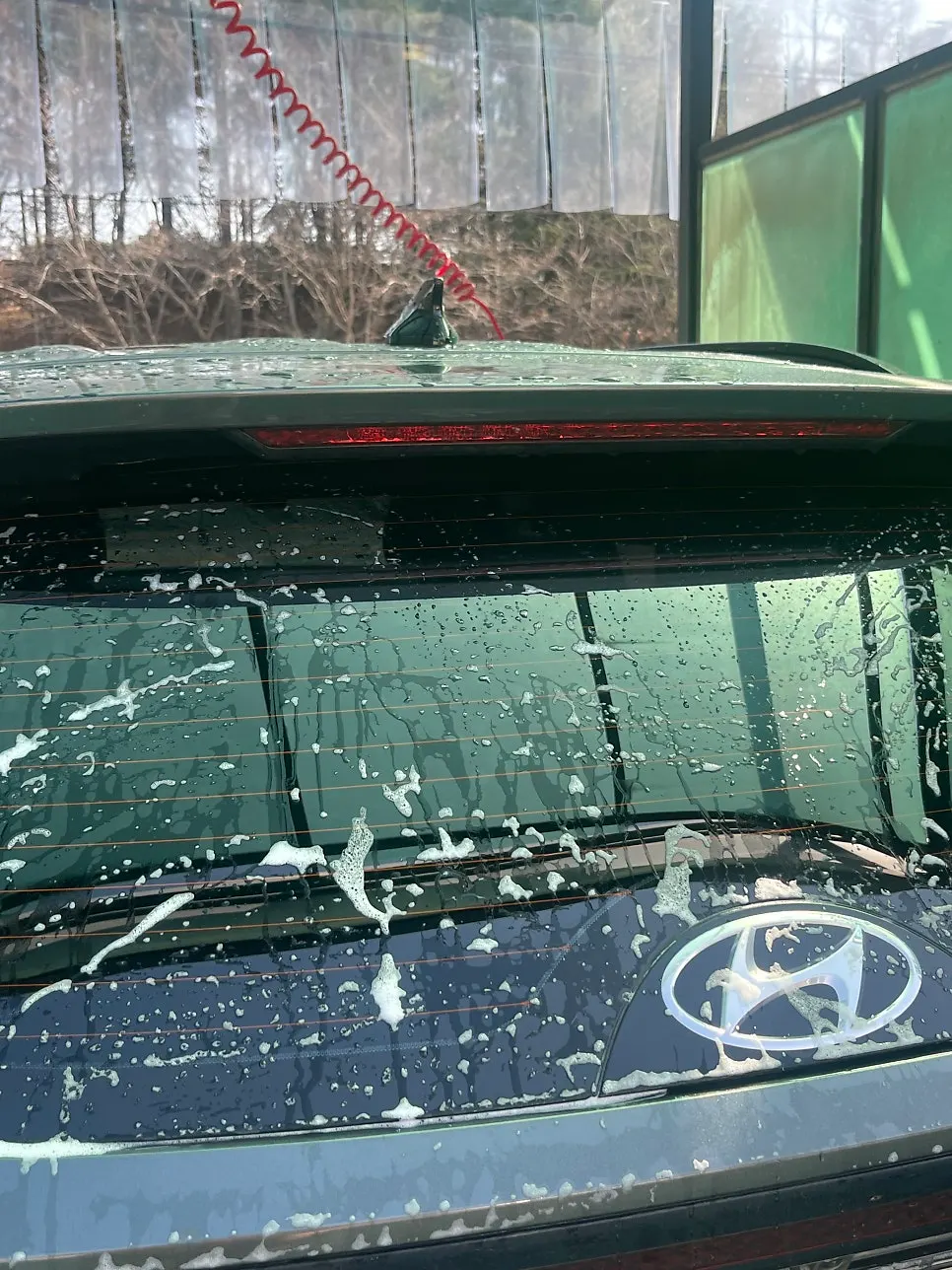 Using oil film remover on the writer’s car