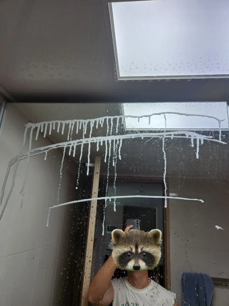 Applying oil-film remover from the top of the bathroom surface