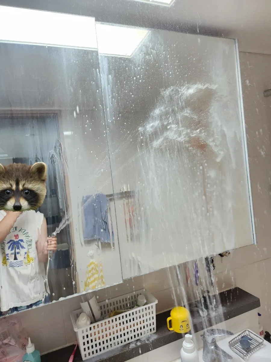 Rinsing oil-film remover off the bathroom surface with water