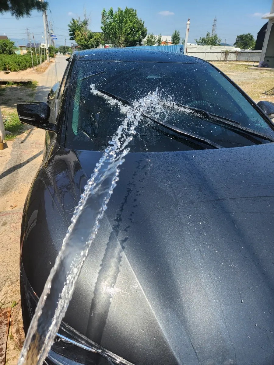 Preparing to clean a car windshield at my parents' house