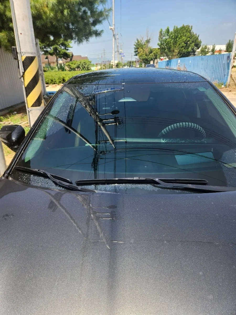 Car windshield and wipers prepared for cleaning