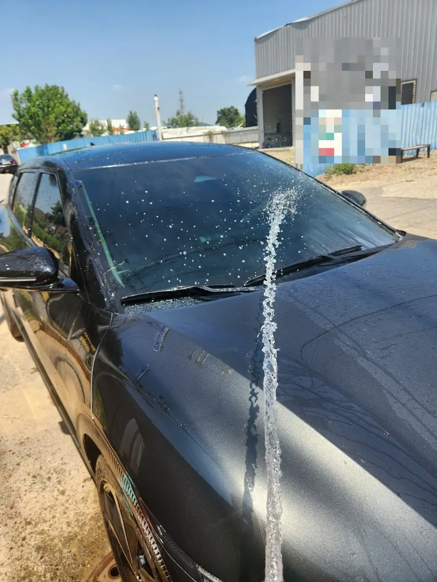 Rinsing oil-film remover from a car windshield