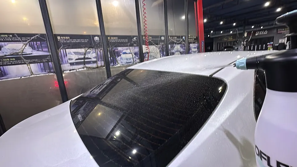 Vehicle pre-wash process using a pump sprayer