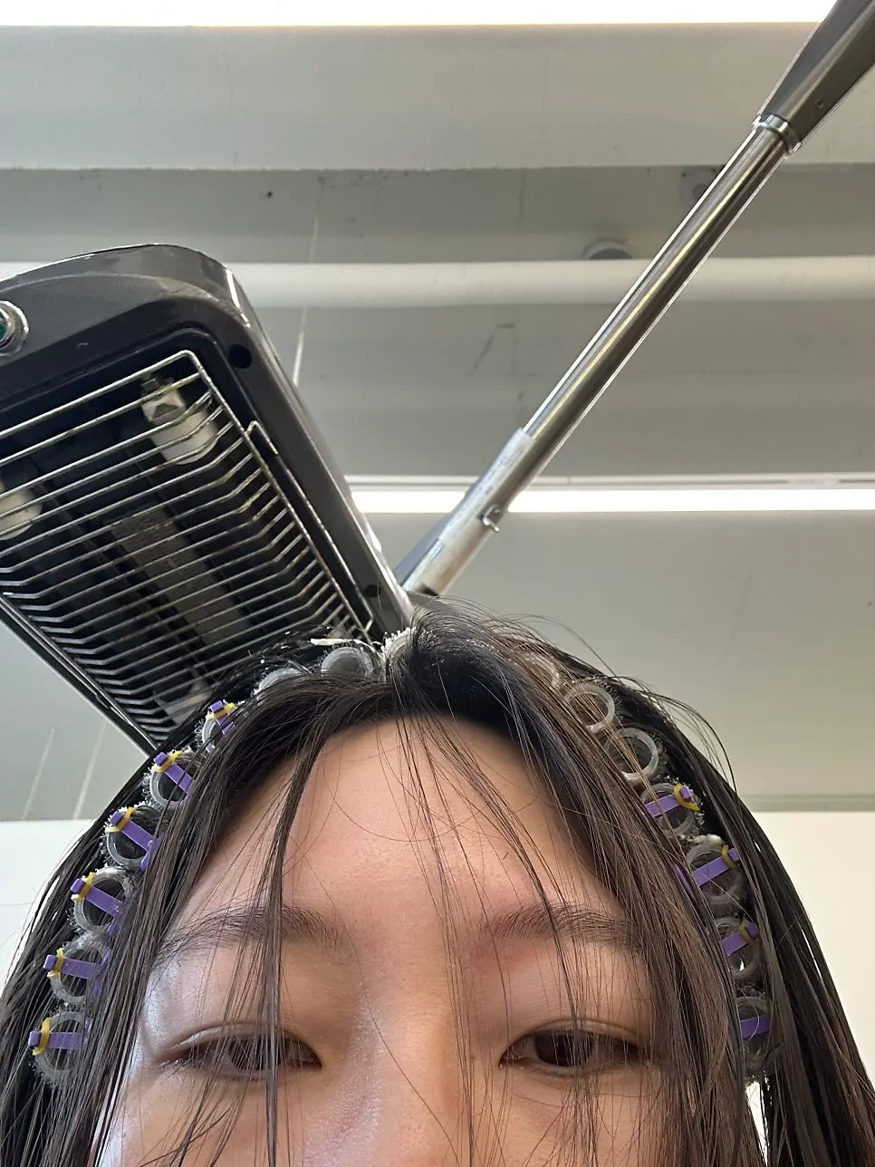 Sitting in front of the mirror before the bob cut