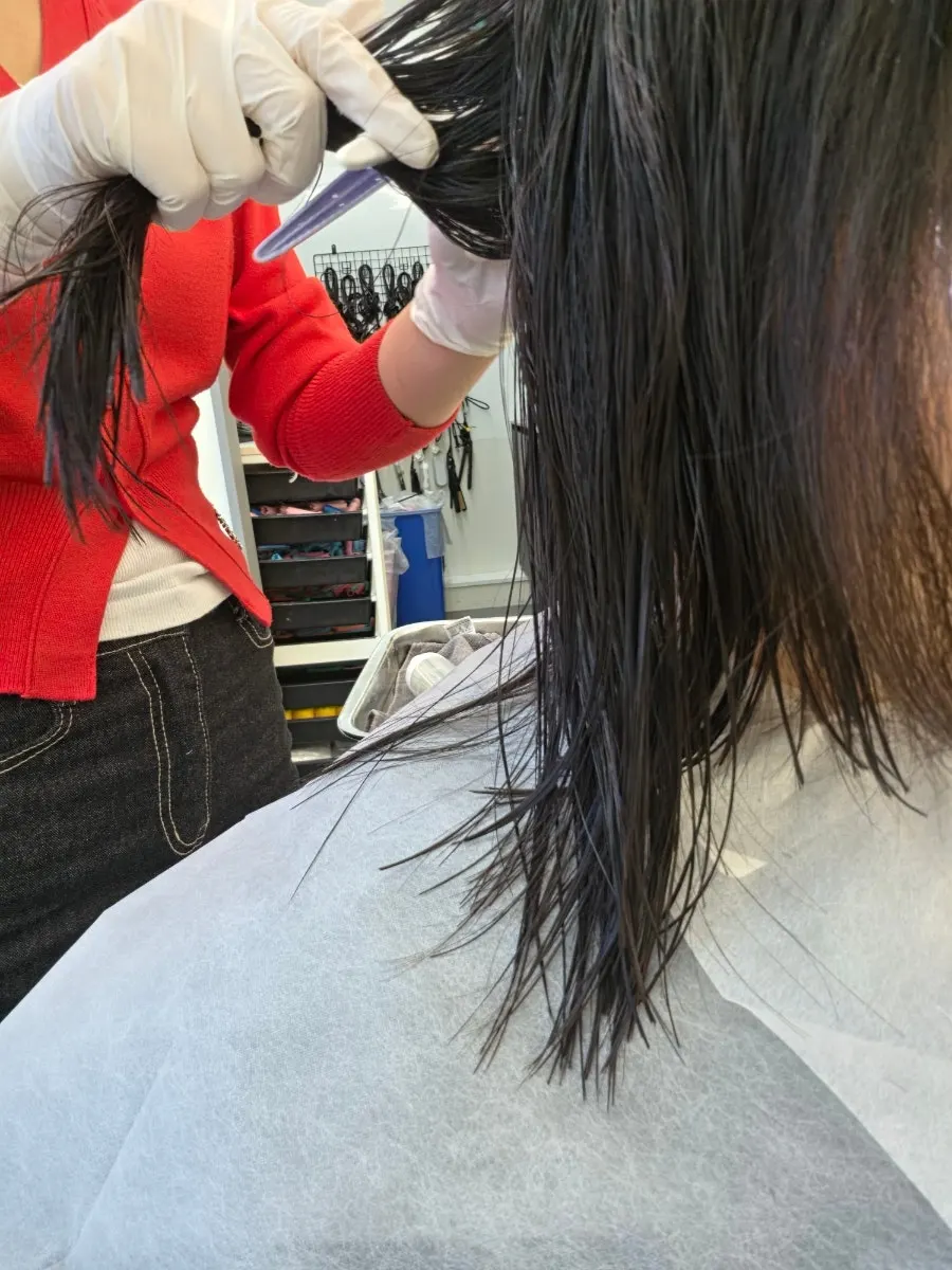 Perm solution applied to mid-length hair