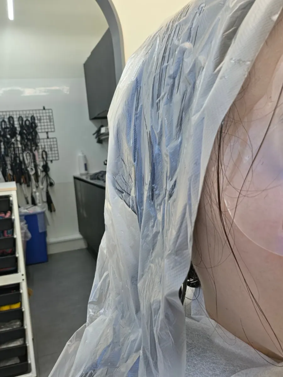 Hair ends rolled in perm rods for the C-curl