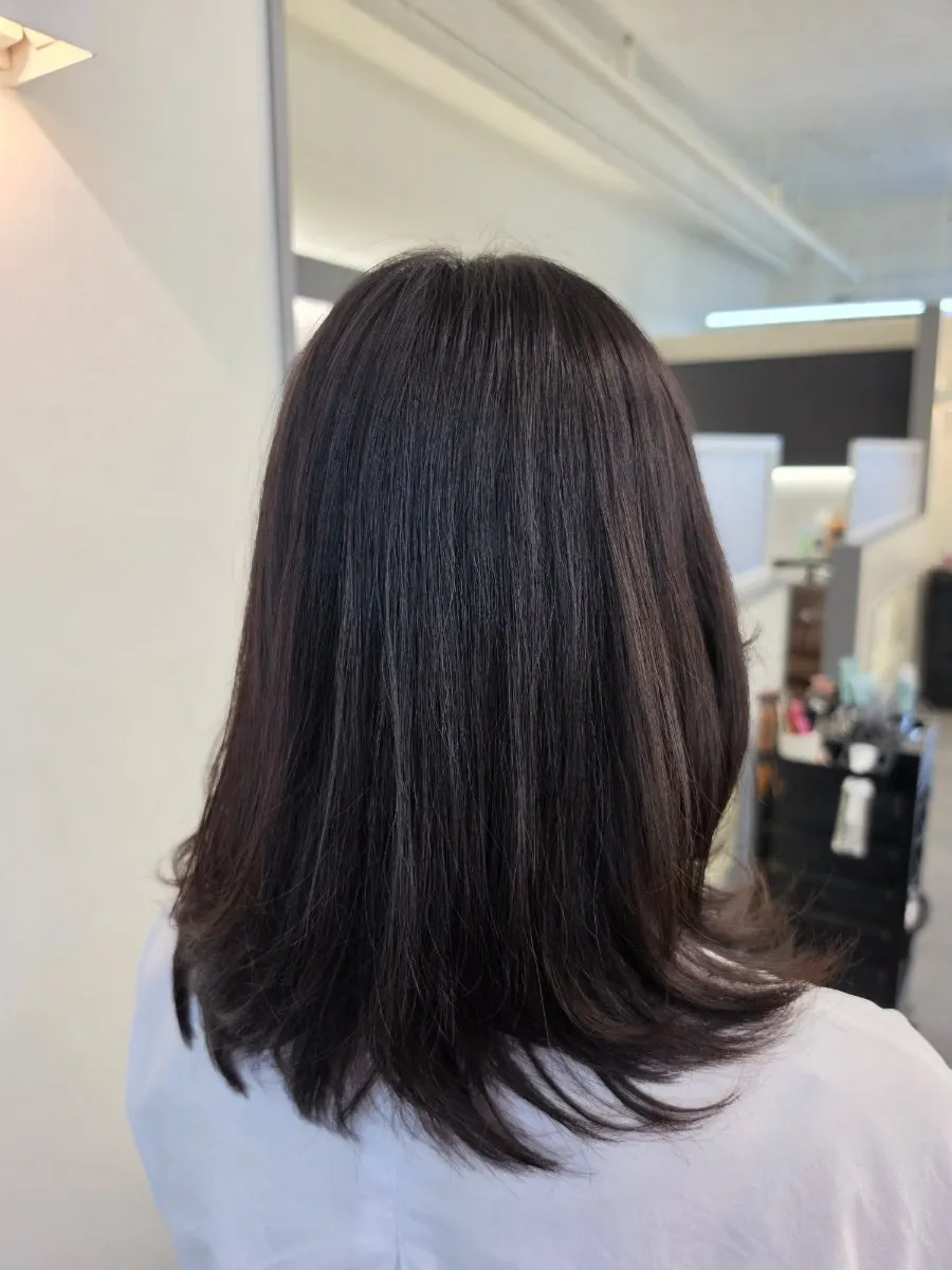 The finished mid-length C-curl perm