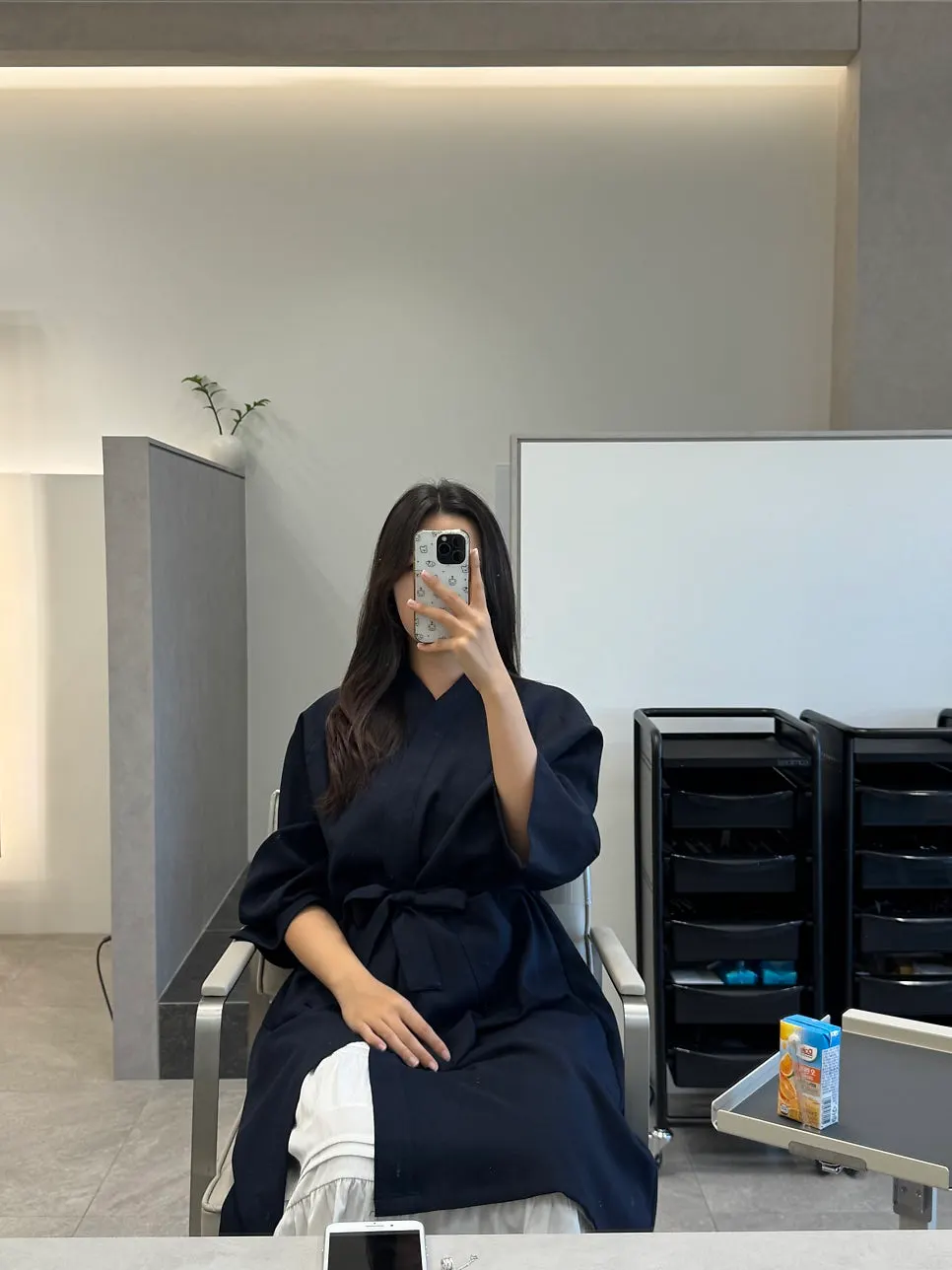 Long hair reaching below the waist before the cut