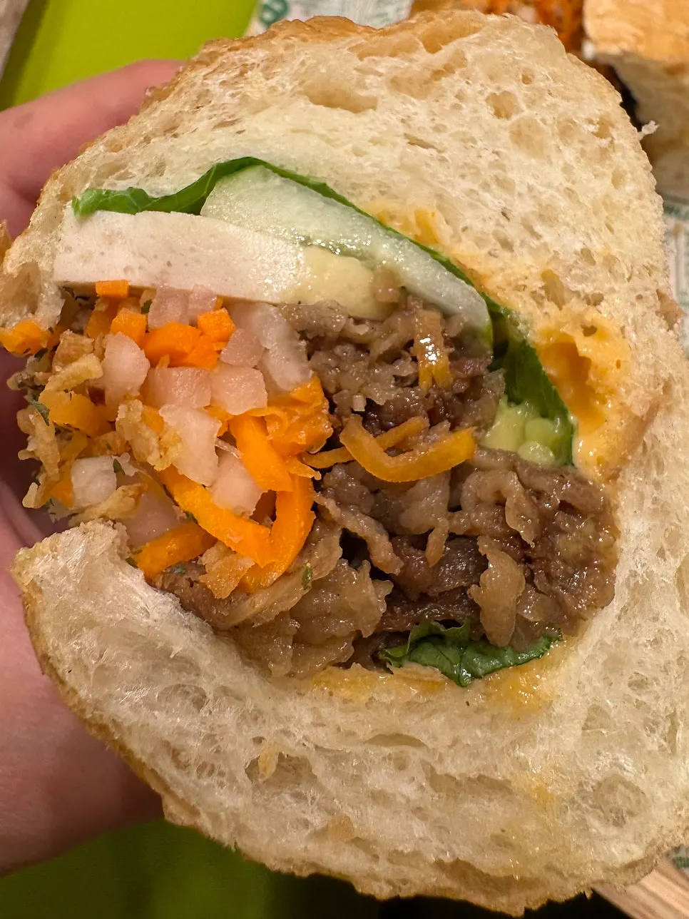 Avocado banh mi cut in half showing the packed filling