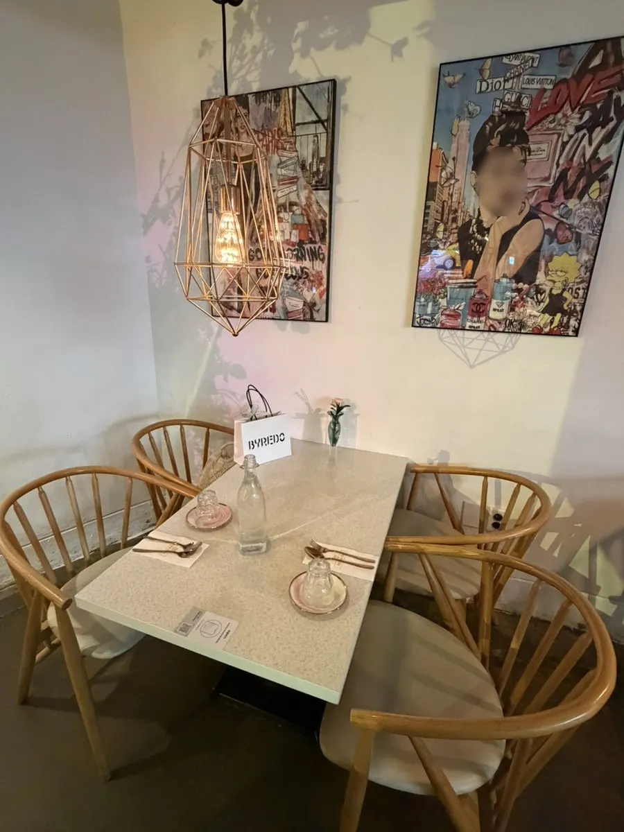 Table decorated with props and flowers at Awesome Rose