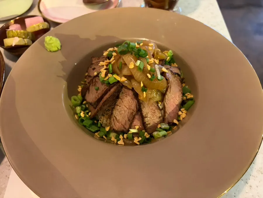 Rose steak rice bowl topped with Hanwoo strip loin steak