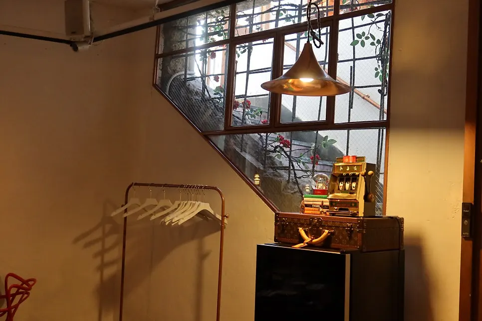 Vintage props and lighting lining the stairway wall