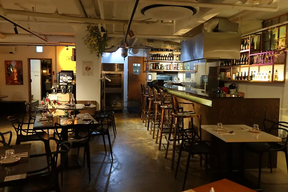 A view of the dining hall split into table seating and bar table