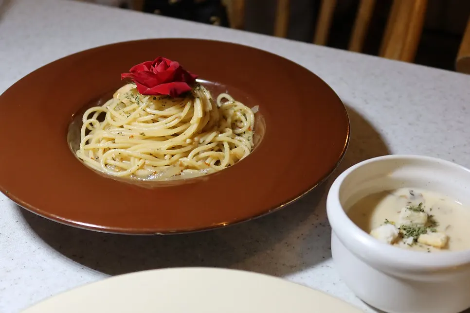 Rose pasta topped with a whole edible rose
