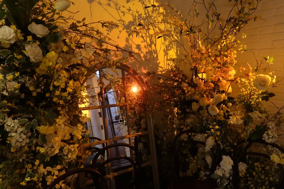 A photo zone at Awesome Rose decorated with roses