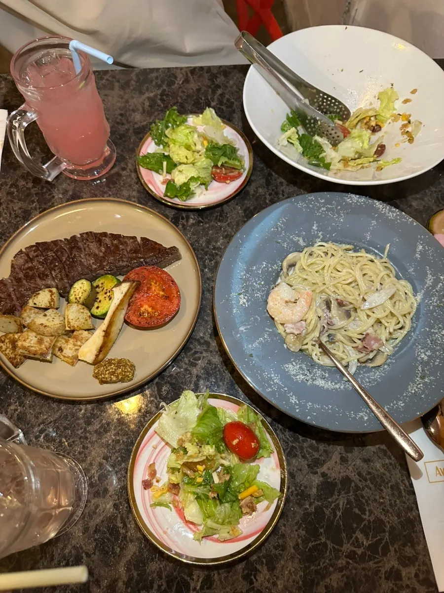 A table set with the meal at Awesome Rose
