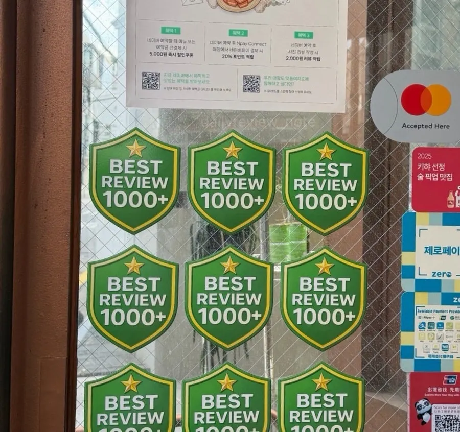 Best-review certifications posted at the entrance of Awesome Rose