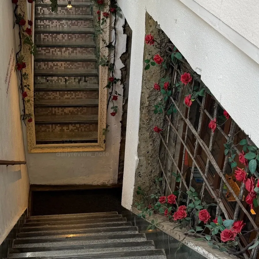 Stairway entrance to Awesome Rose decorated with roses