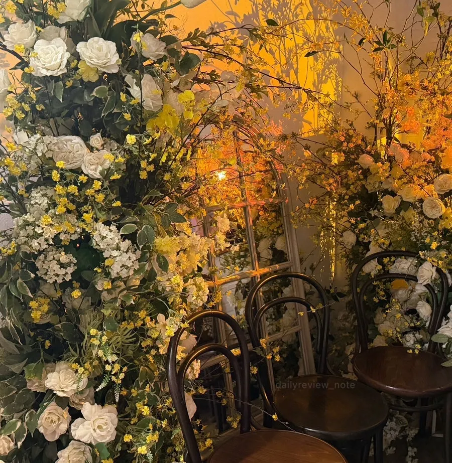 Interior of Awesome Rose decorated with flowers and props