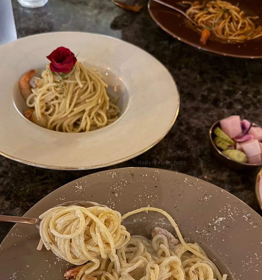 Table with all three sauce-based pastas set together