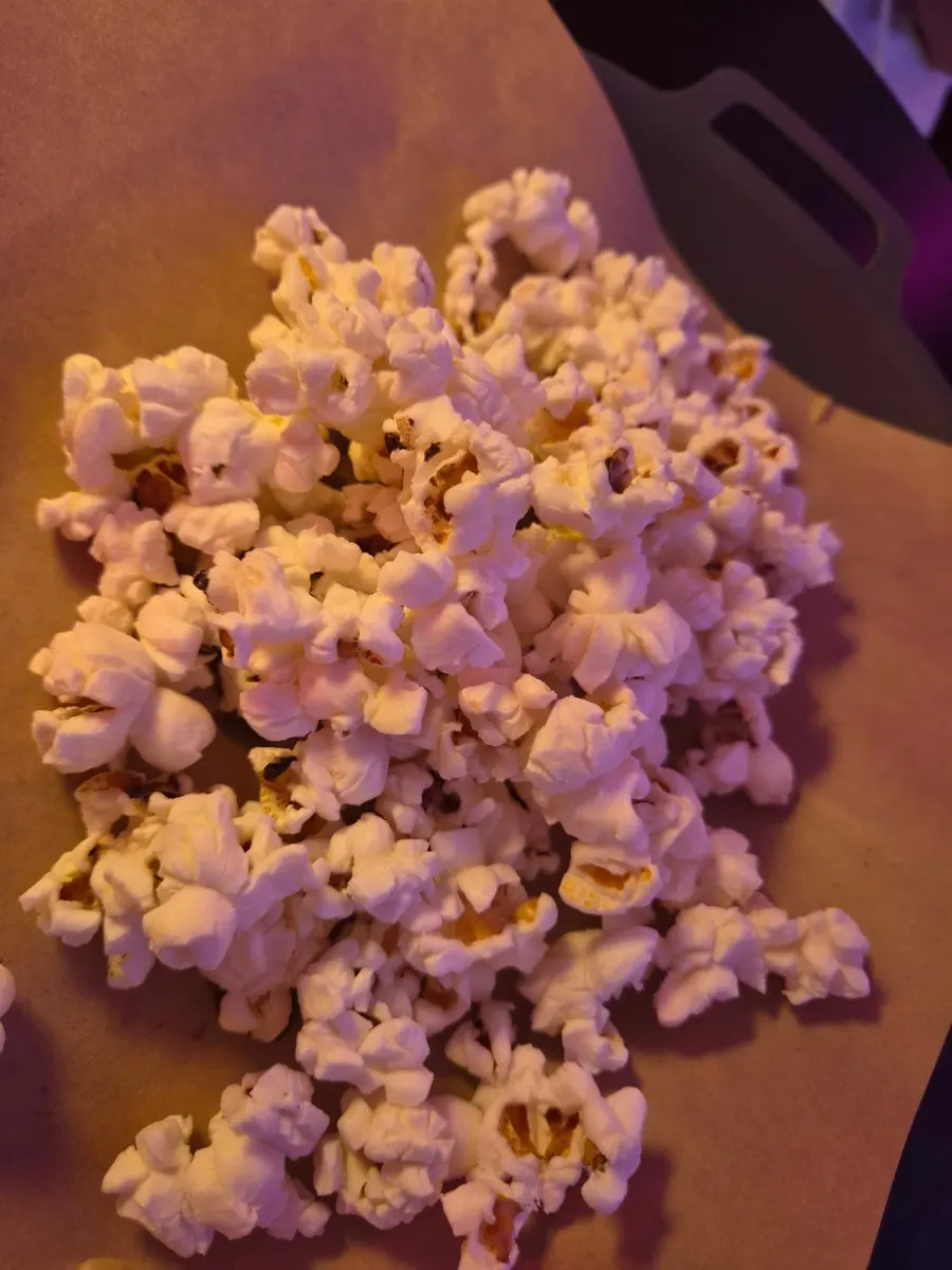 Kahlua milk served with butter popcorn and nachos
