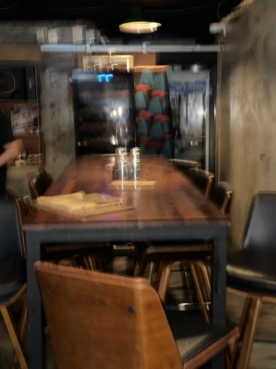 The larger table area across from the main seating at B421