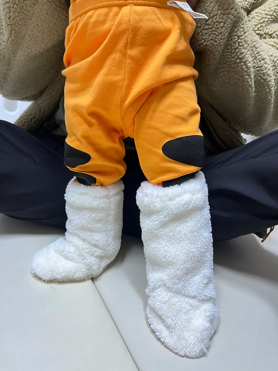 Foot warmer fit on a 14-month-old baby