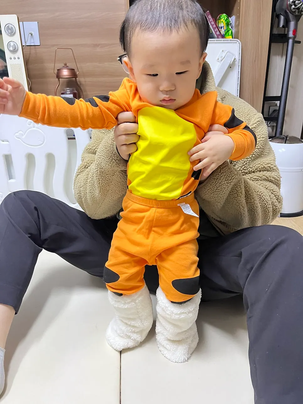 Baby wearing foot warmers for a stroller outing