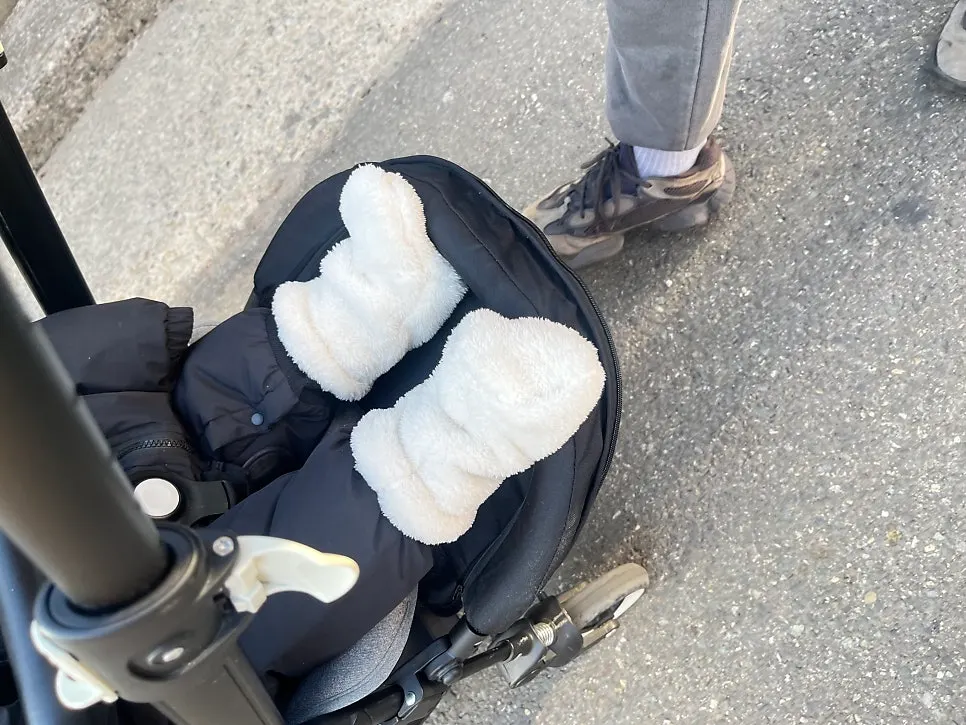 Baby on a winter outing along the market street