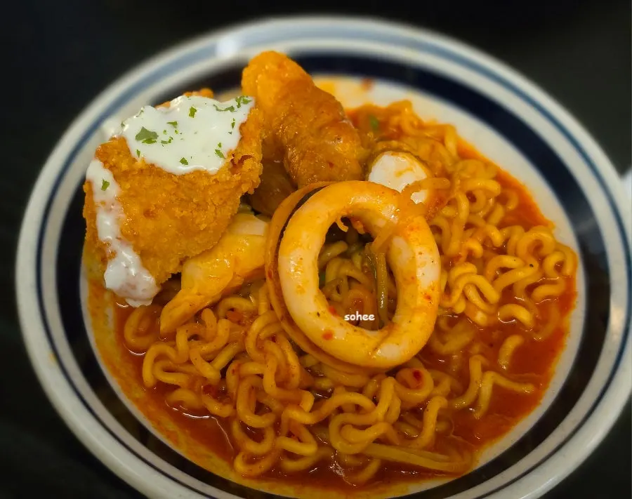 Plate of ramyeon noodles cooked in the seafood broth, scooped out