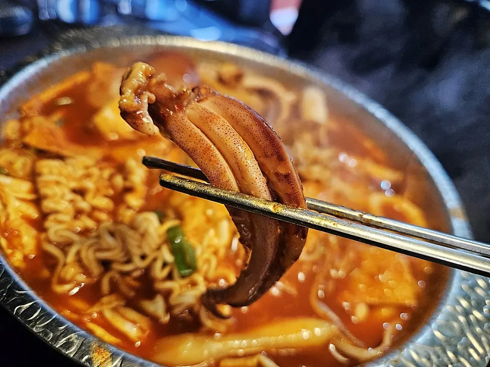 Spicy tteokjjim broth with seafood ingredients