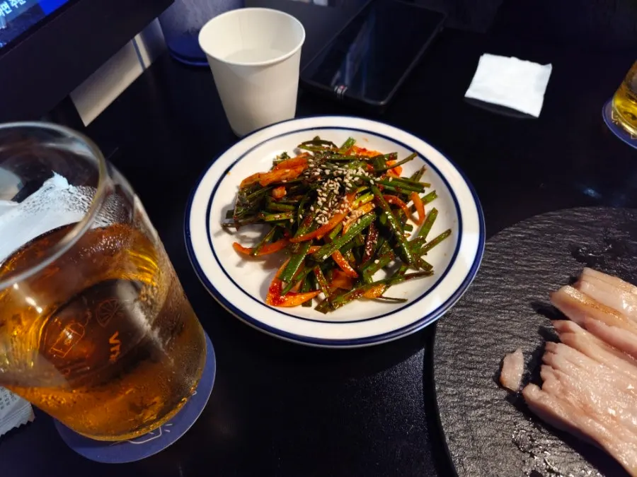 Extra plate of chive salad given by the staff