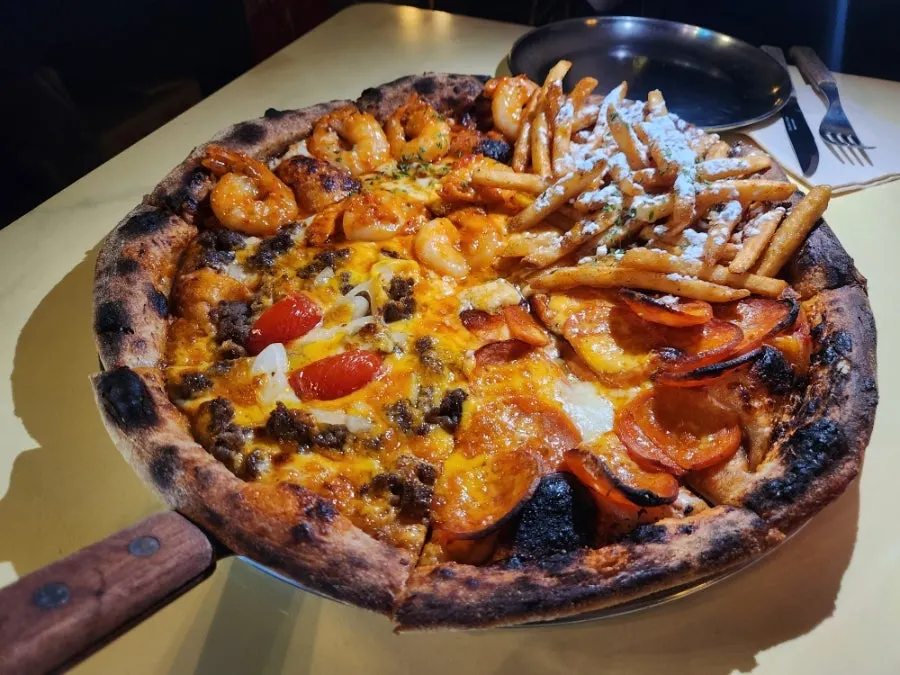 Large Quarter Street pizza divided into four flavors