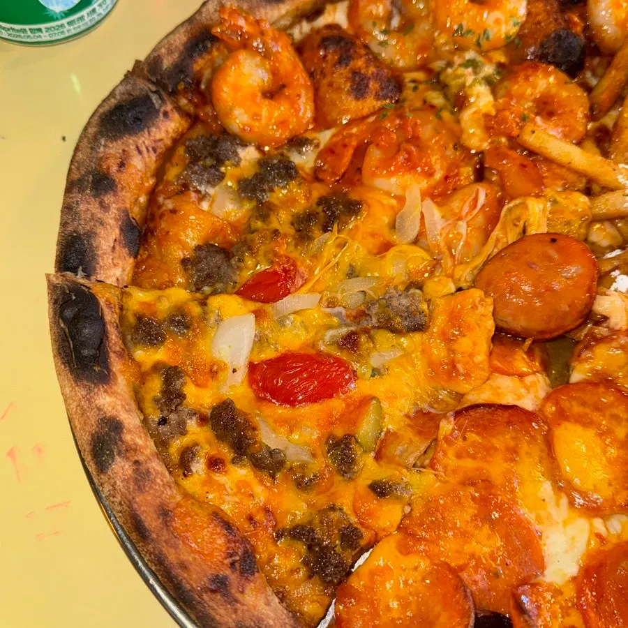 Close-up of pizza toppings on a slice