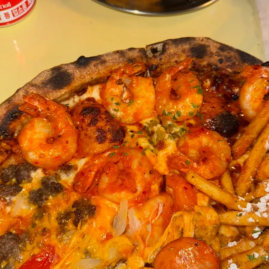 Pizza slice showing crispy dough edge