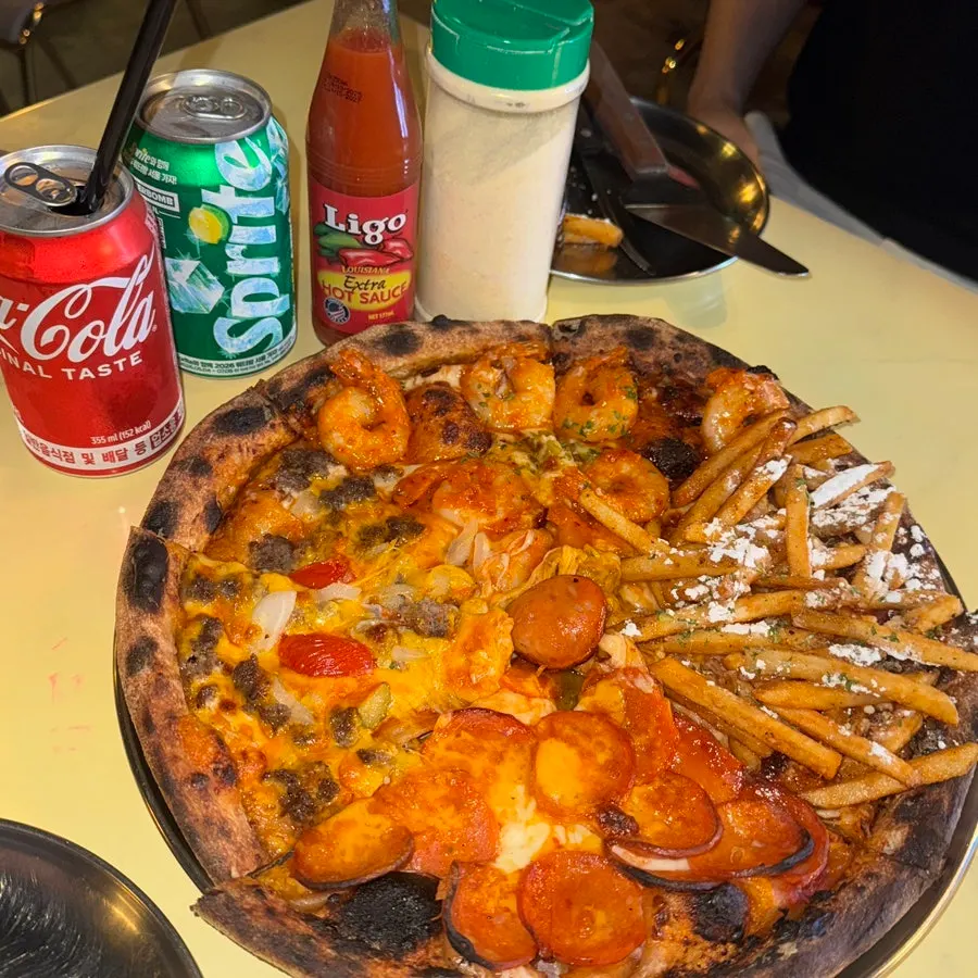 Slice of pizza piled high with sausage