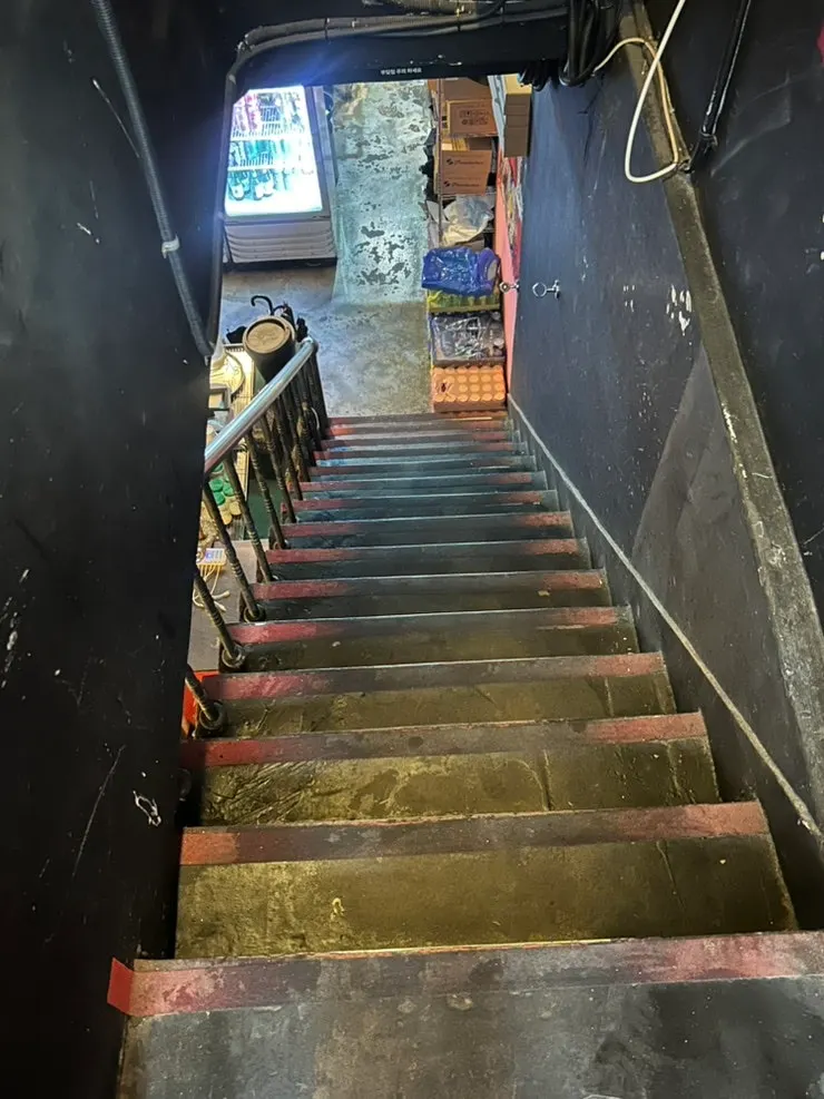 Stairs leading down to the basement restaurant
