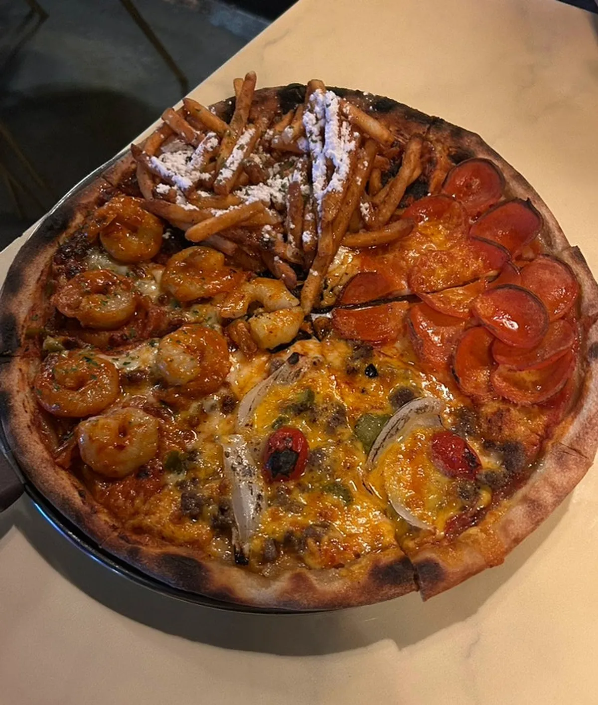 A whole Quarter Street pizza loaded with toppings