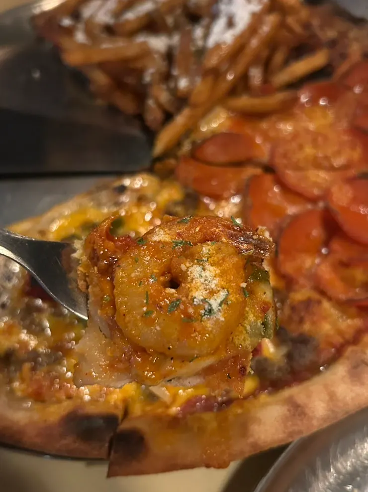 Pizza slice with stretchy melted cheese