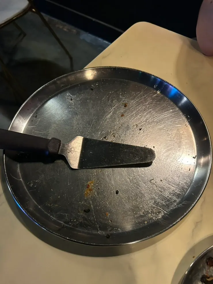 Empty pizza plate with not a single slice left