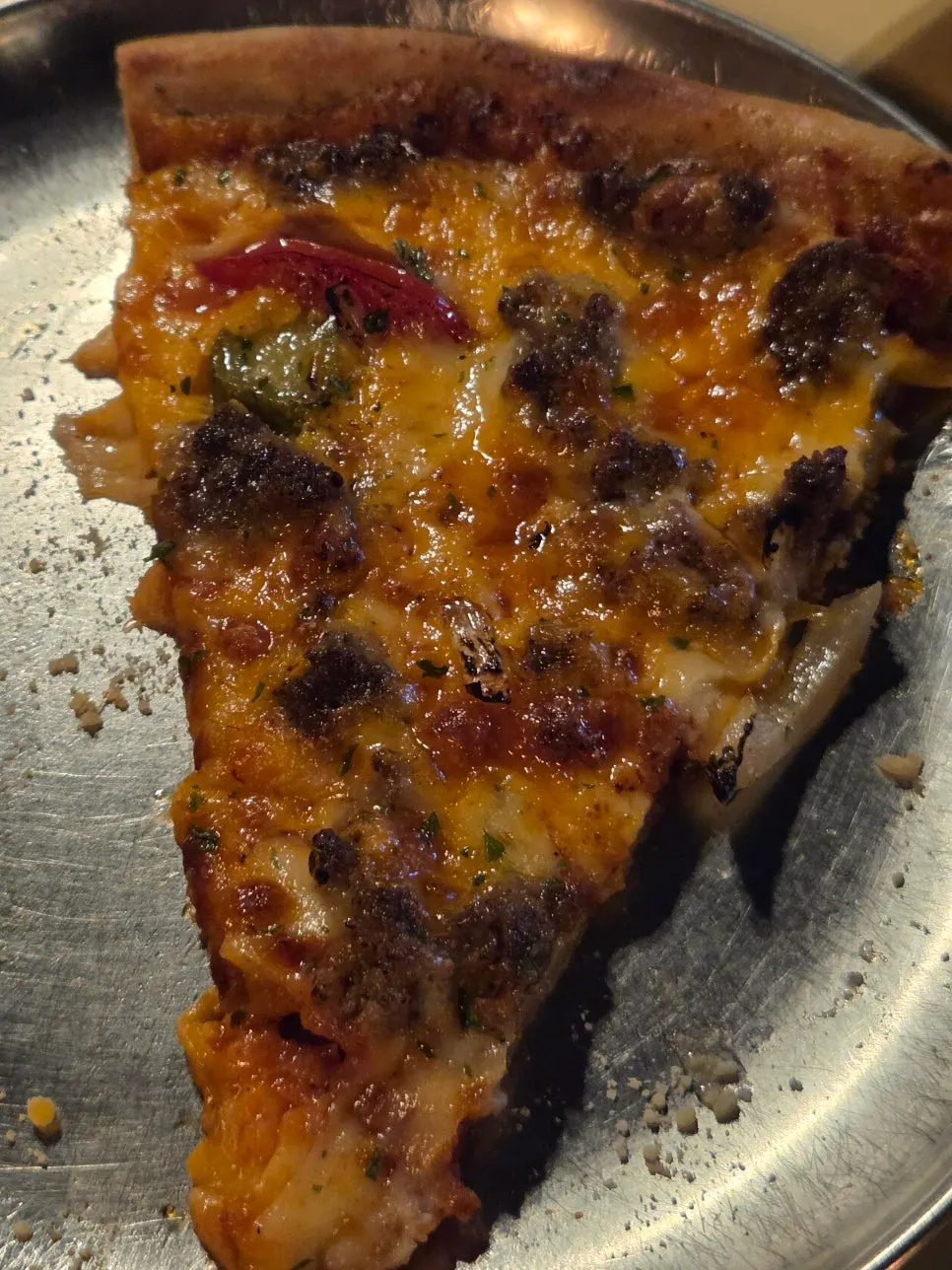 Cheese & Patty Bomb slice showing beef patty and jalapeño