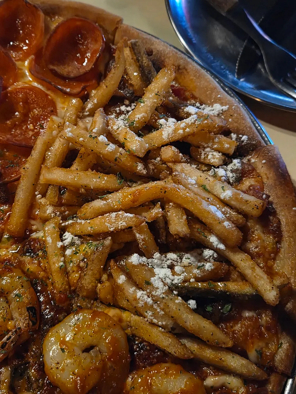 Potato Killer topped with fries and bacon
