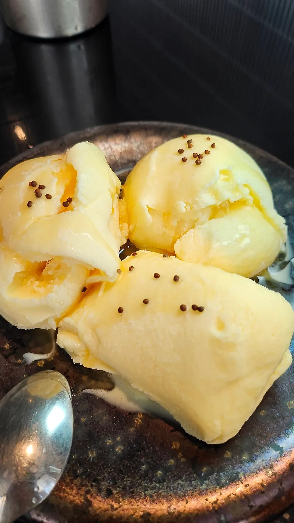 Perilla oil ice cream topped with whole perilla seeds