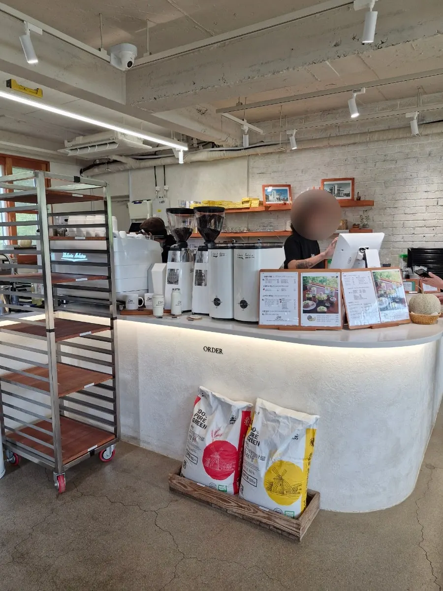 Terrace seating and garden view at Baedagol Bakery House