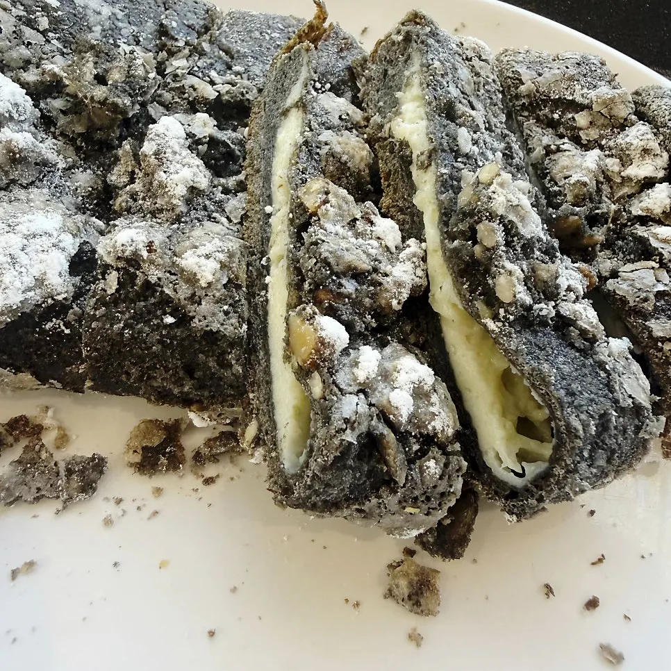 Cross-section of six-clove garlic bread packed with garlic cream cheese