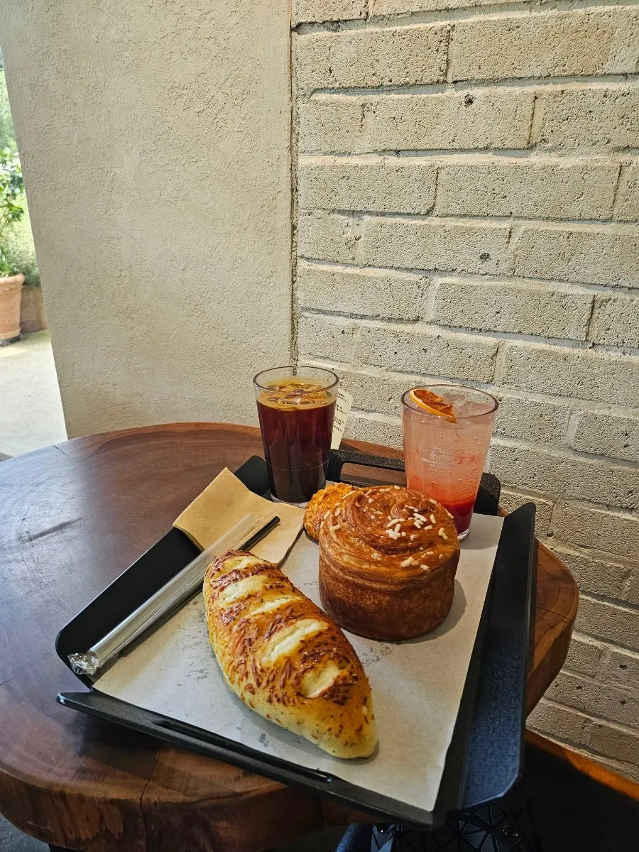Drink menu board listing coffee, tea, bingsu and more