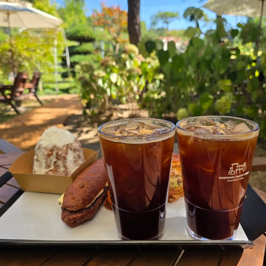 Iced Americano with walnut bread, hazelnut ambutter, and pandoro