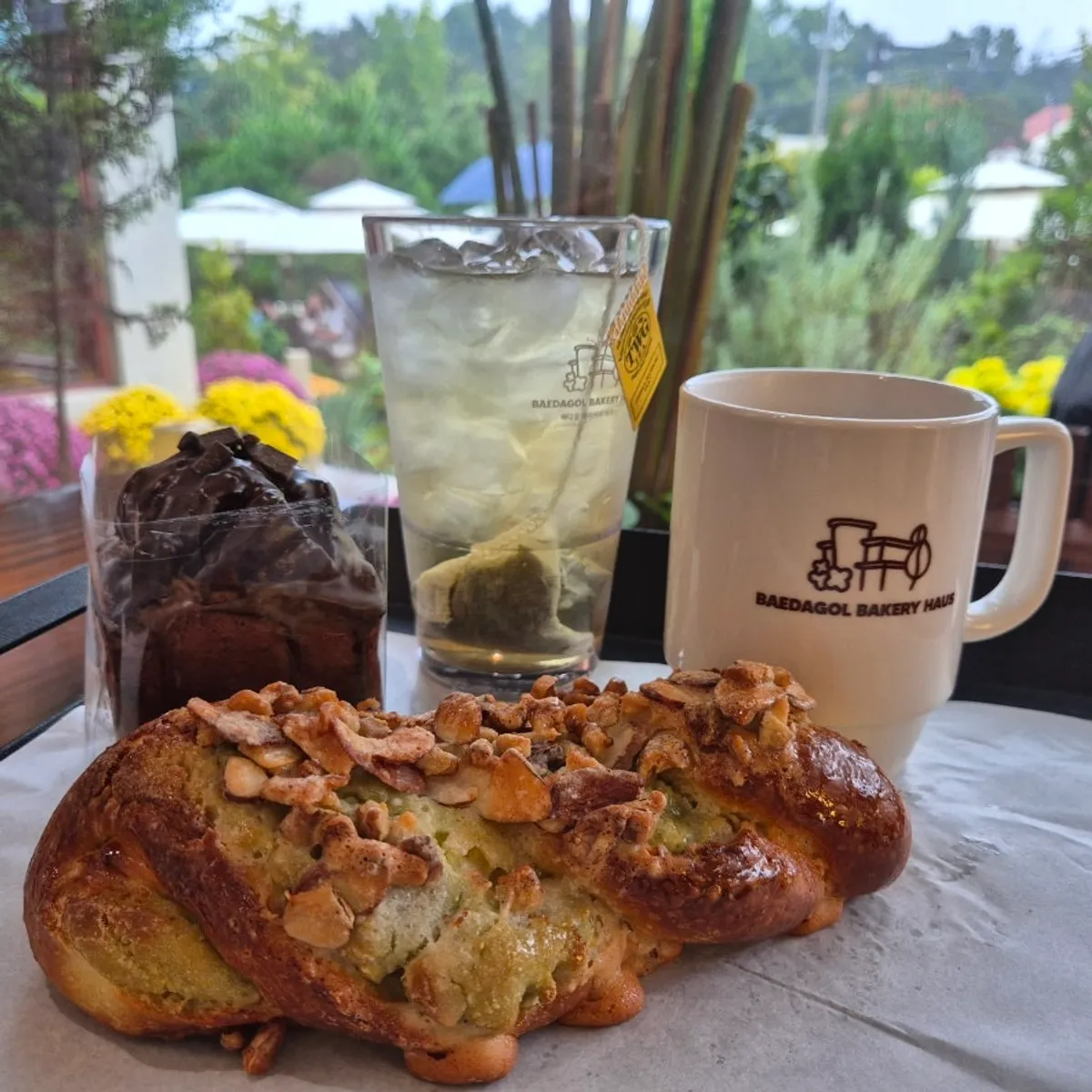Americano, TWG iced tea, and two bakery items set together