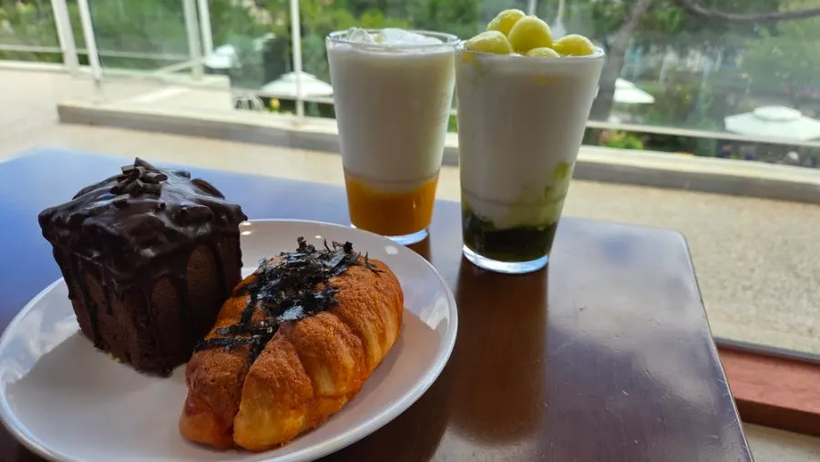 Two yogurt smoothies set with bread